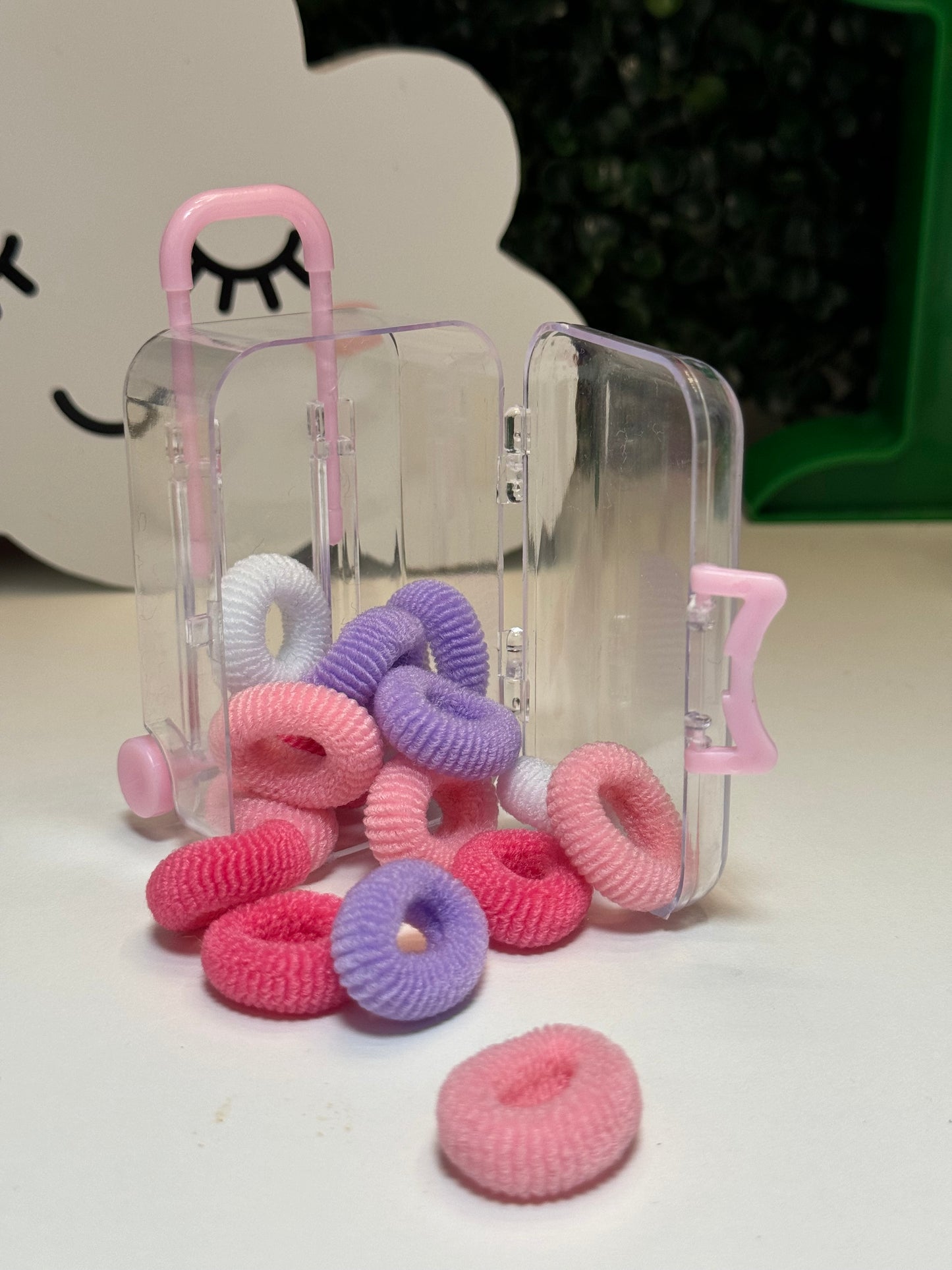 Suitcase hair ties