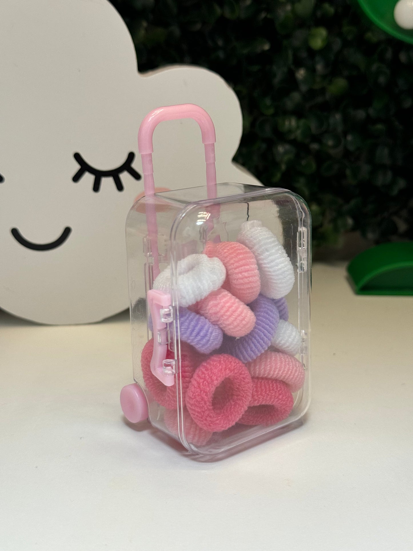 Suitcase hair ties