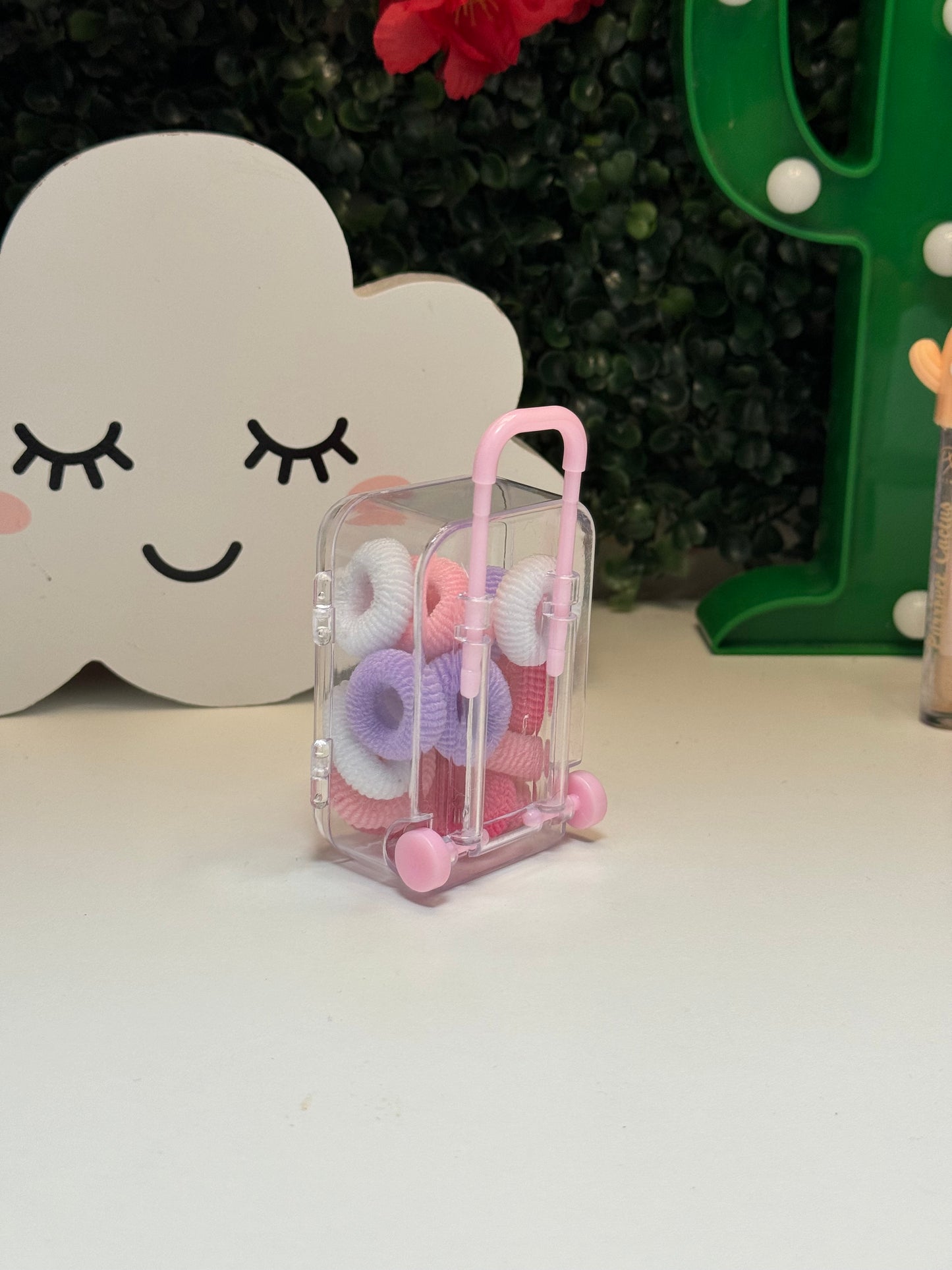 Suitcase hair ties